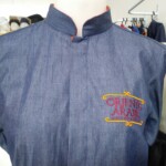 Camisa social manga curta, modleo gola padre com botões cobertos Camisa Social - Uniformes Profissionais em Curitiba